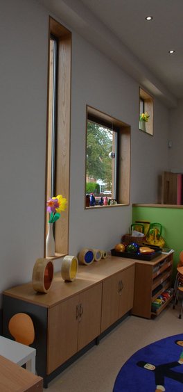 Varied window shapes bring fun to nursey play area